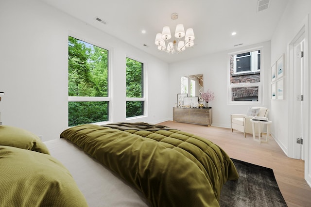 1333 E Madison Park, Chicago, IL 60615 - bedroom featuring a chandelier, light wood-style flooring, and recessed lighting