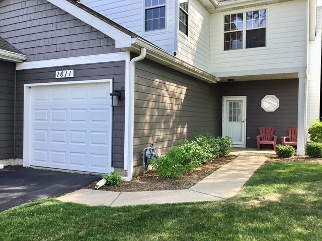 1611 Woodcrest Cir, Mundelein, IL 60060 - doorway to property featuring an attached garage
