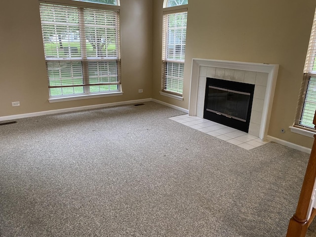 1611 Woodcrest Cir, Mundelein, IL 60060 - unfurnished living room featuring carpet floors and a fireplace