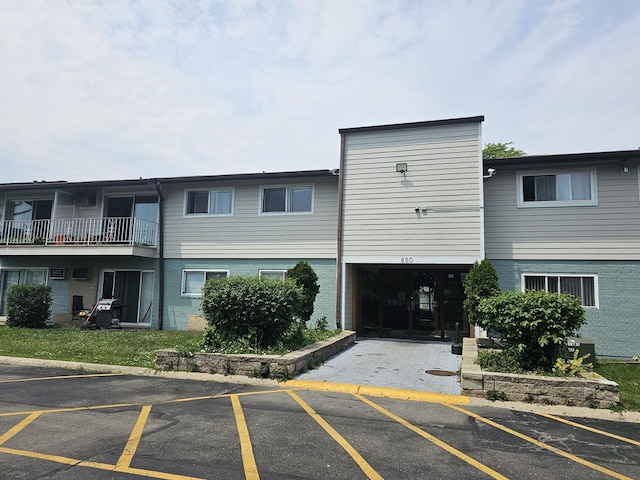 850 E Old Willow Rd Unit 207, Prospect Heights, IL 60070 - view of building exterior featuring uncovered parking