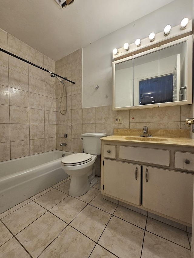 850 E Old Willow Rd Unit 207, Prospect Heights, IL 60070 - full bath featuring vanity, tile walls, washtub / shower combination, tile patterned flooring, and toilet