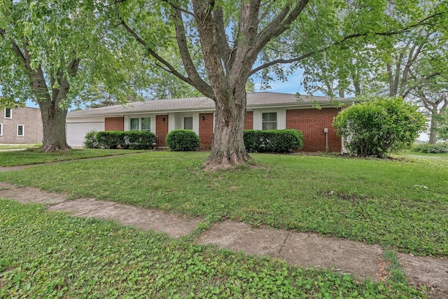 1635 N 4012th Rd, Earlville, IL 60518 - single story home featuring an attached garage, brick siding, and a front yard