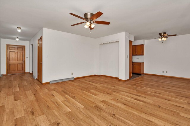 1635 N 4012th Rd, Earlville, IL 60518 - unfurnished living room with ceiling fan and light wood finished floors