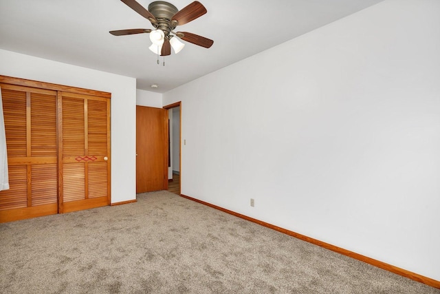 1635 N 4012th Rd, Earlville, IL 60518 - unfurnished bedroom featuring carpet, a closet, and ceiling fan