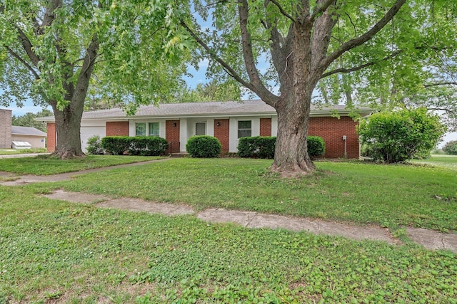 1635 N 4012th Rd, Earlville, IL 60518 - ranch-style home with brick siding, a front lawn, and a garage