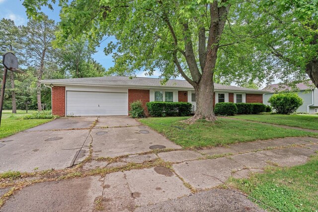 1635 N 4012th Rd, Earlville, IL 60518 - single story home featuring brick siding, driveway, an attached garage, and a front lawn