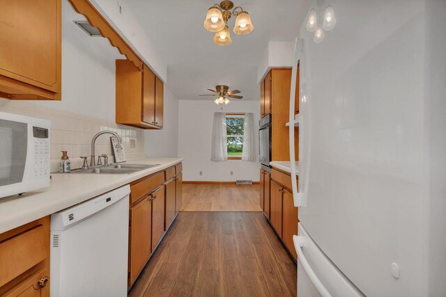 1635 N 4012th Rd, Earlville, IL 60518 - kitchen with white appliances, brown cabinets, and backsplash