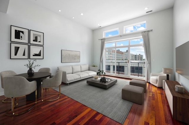 2847 N Pulaski Rd Unit 3S, Chicago, IL 60641 - living room featuring a towering ceiling, wood finished floors, and recessed lighting