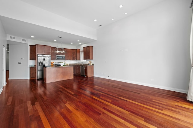 2847 N Pulaski Rd Unit 3S, Chicago, IL 60641 - unfurnished living room with dark wood-style flooring and recessed lighting