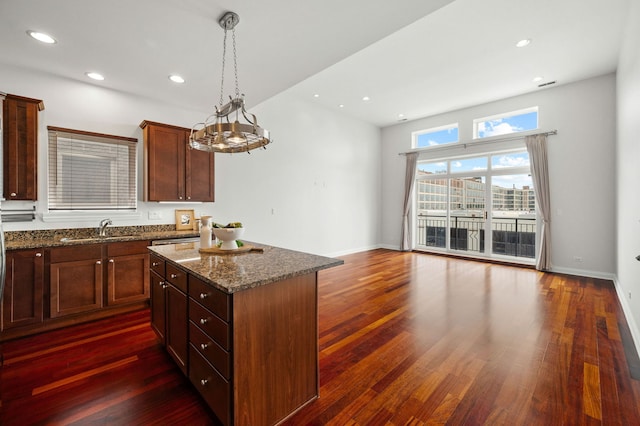 2847 N Pulaski Rd Unit 3S, Chicago, IL 60641 - kitchen with a center island, dark wood-type flooring, dark stone countertops, and recessed lighting