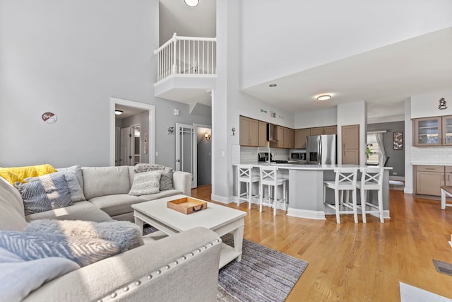 1132 Locust Ct, Bartlett, IL 60103 - living area with light wood-type flooring and a towering ceiling