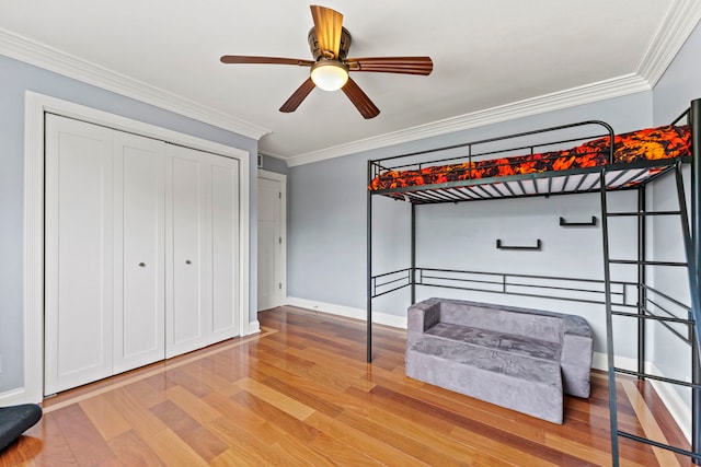 1132 Locust Ct, Bartlett, IL 60103 - bedroom with light wood finished floors, crown molding, a closet, and a ceiling fan