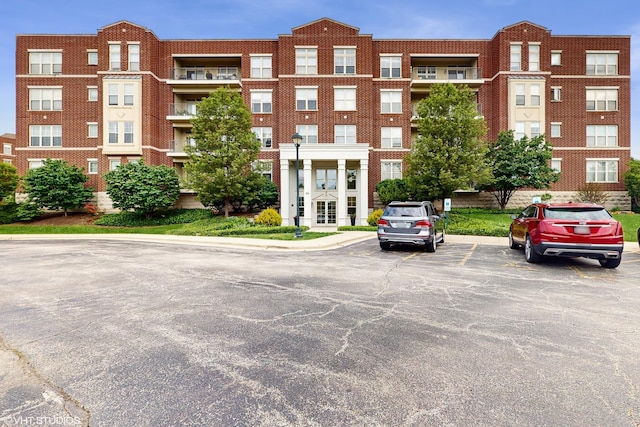 720 Prestwick Ln Unit 207, Wheeling, IL 60090 - view of property featuring uncovered parking
