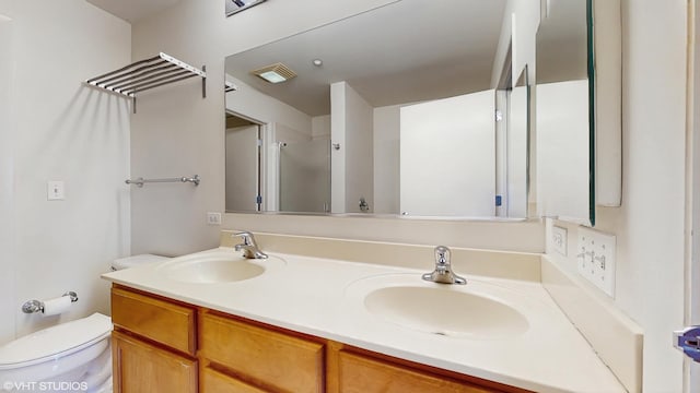 720 Prestwick Ln Unit 207, Wheeling, IL 60090 - bathroom featuring double vanity, toilet, and a shower