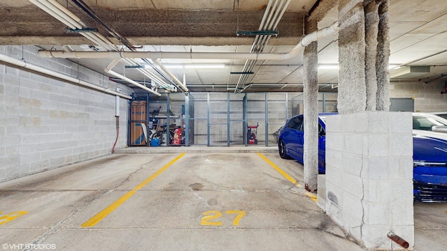 720 Prestwick Ln Unit 207, Wheeling, IL 60090 - parking deck featuring concrete block wall