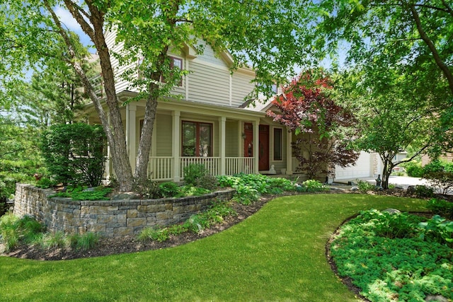 25014 W Nicklaus Way, Antioch, IL 60002 - view of front of house featuring a porch, a front yard, and a garage