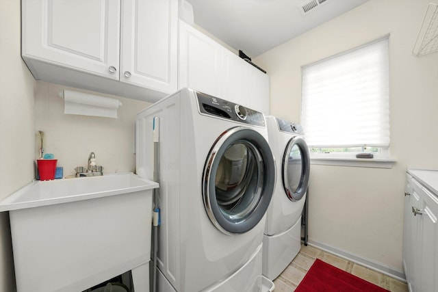 25014 W Nicklaus Way, Antioch, IL 60002 - laundry area featuring washing machine and dryer and cabinet space