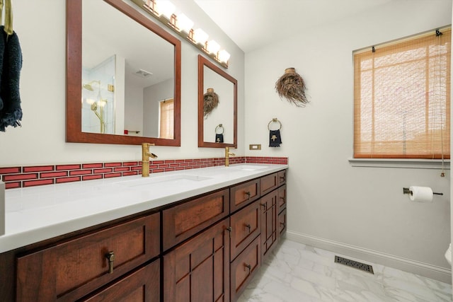 25014 W Nicklaus Way, Antioch, IL 60002 - full bath featuring marble look tile flooring, double vanity, and decorative backsplash