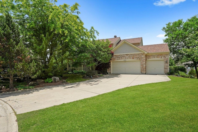 25014 W Nicklaus Way, Antioch, IL 60002 - view of front of property featuring an attached garage, concrete driveway, a front lawn, stone siding, and roof with shingles