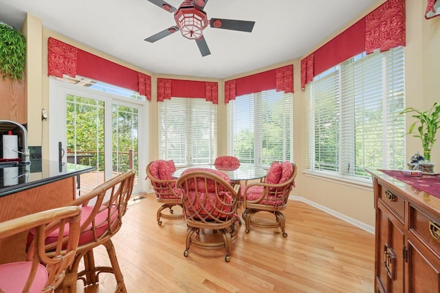 25014 W Nicklaus Way, Antioch, IL 60002 - dining area with a ceiling fan, healthy amount of natural light, and light wood-style flooring