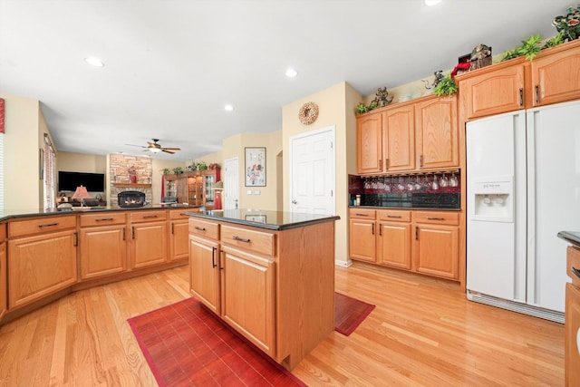 25014 W Nicklaus Way, Antioch, IL 60002 - kitchen with white refrigerator with ice dispenser, dark countertops, light wood finished floors, open floor plan, and a ceiling fan