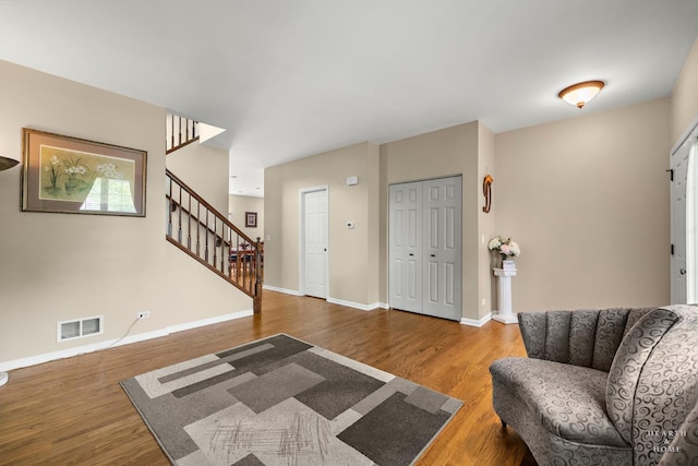 11582 Beacon Ave, Huntley, IL 60142 - entryway featuring stairs, wood finished floors, and baseboards
