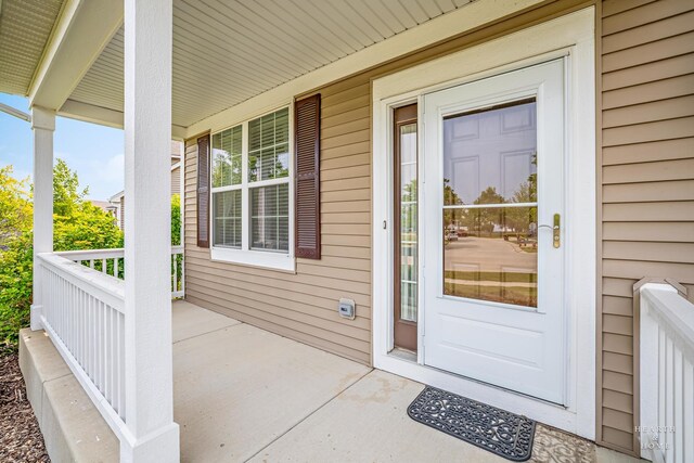 11582 Beacon Ave, Huntley, IL 60142 - doorway to property featuring covered porch