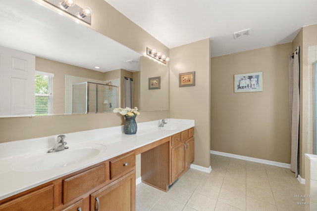11582 Beacon Ave, Huntley, IL 60142 - full bath featuring double vanity, tiled shower, and tile patterned flooring