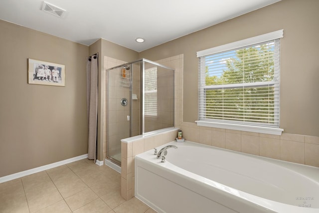 11582 Beacon Ave, Huntley, IL 60142 - full bathroom with a bath, a stall shower, and tile patterned floors