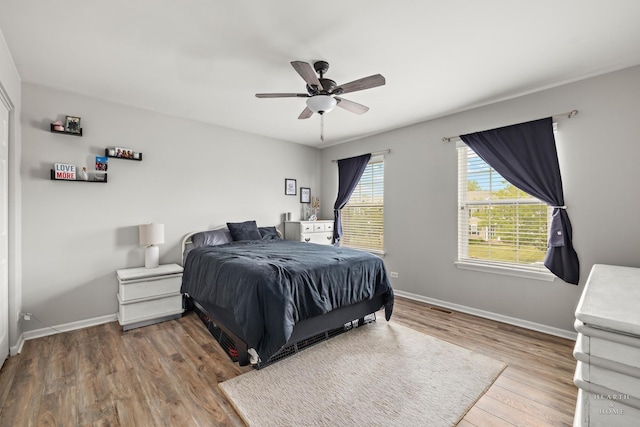 11582 Beacon Ave, Huntley, IL 60142 - bedroom with wood finished floors, baseboards, and ceiling fan