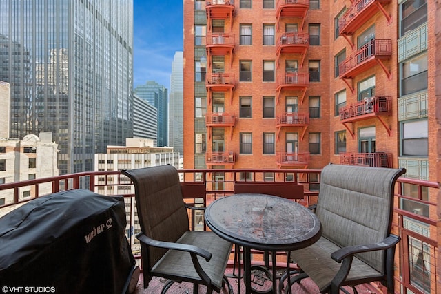 208 W Washington St Unit 1205, Chicago, IL 60606 - balcony featuring a view of city and a grill