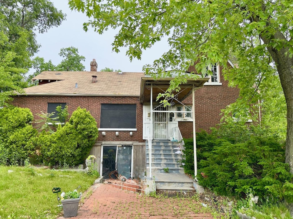 14846 Woodlawn Ave, Dolton, IL 60419 - back of property featuring brick siding and a chimney
