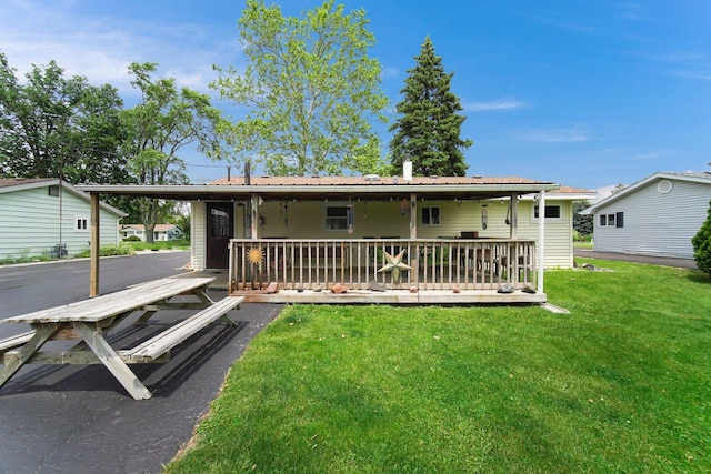 16419 W 147th Pl, Lockport, IL 60441 - rear view of house featuring a yard, a wooden deck, and a carport