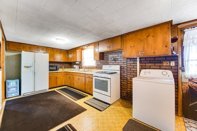 16419 W 147th Pl, Lockport, IL 60441 - kitchen with white appliances, washer / dryer, healthy amount of natural light, and light countertops