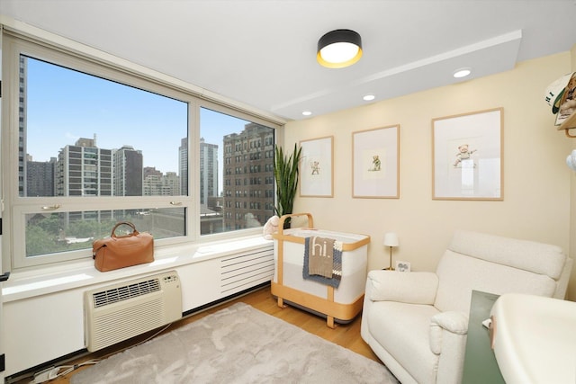 88 W Schiller St Unit 1001L, Chicago, IL 60610 - living area with plenty of natural light, wood finished floors, recessed lighting, and a city view