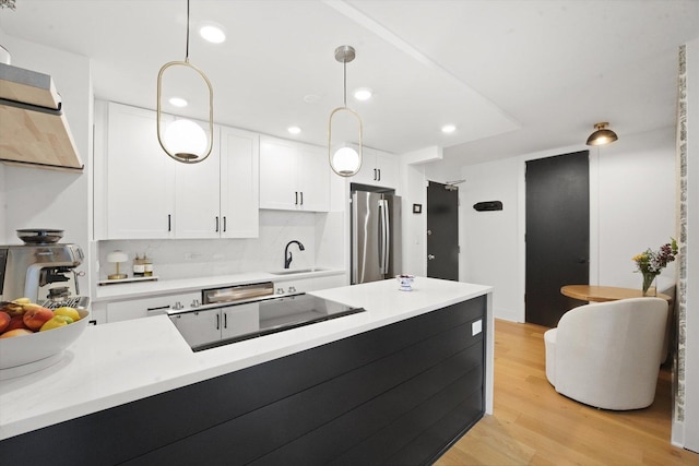 88 W Schiller St Unit 1001L, Chicago, IL 60610 - kitchen featuring freestanding refrigerator, white cabinets, light wood finished floors, light countertops, and recessed lighting