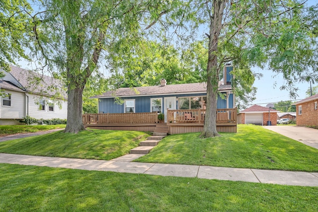 611 S Monroe St, Streator, IL 61364 - view of front of house featuring a front lawn, a wooden deck, and a chimney