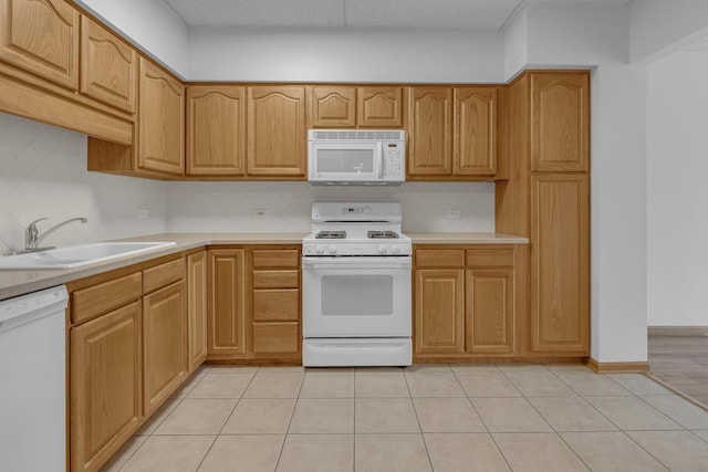 5055 W Madison St Unit 511, Skokie, IL 60077 - kitchen featuring white appliances, backsplash, light countertops, and light tile patterned floors