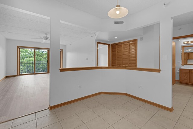5055 W Madison St Unit 511, Skokie, IL 60077 - unfurnished room featuring a ceiling fan and light tile patterned flooring