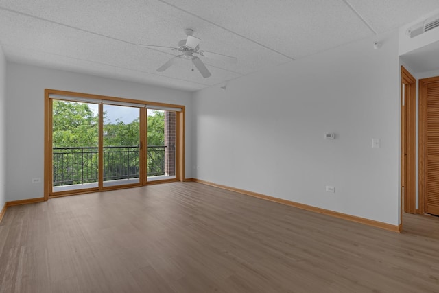 5055 W Madison St Unit 511, Skokie, IL 60077 - unfurnished room featuring light wood-style floors, a ceiling fan, and a textured ceiling