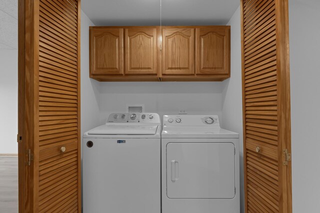 5055 W Madison St Unit 511, Skokie, IL 60077 - washroom featuring washer and dryer and cabinet space