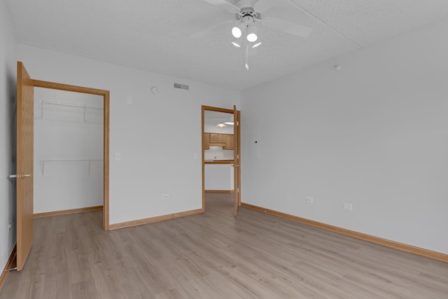 5055 W Madison St Unit 511, Skokie, IL 60077 - unfurnished room with light wood-style floors and a ceiling fan
