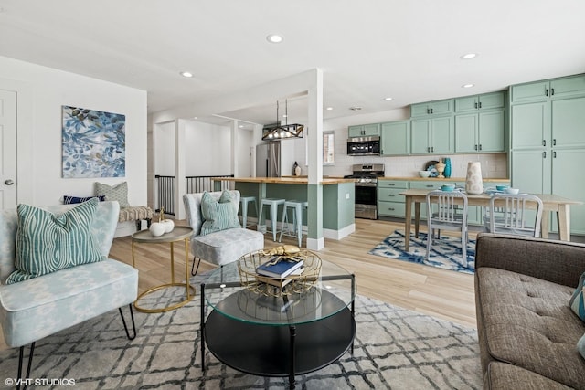 5247 N California Ave, Chicago, IL 60625 - living area featuring light wood-type flooring, recessed lighting, and a chandelier