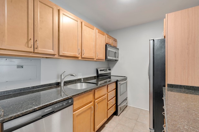 535 N Michigan Ave Unit 2205, Chicago, IL 60611 - kitchen featuring stainless steel appliances, light tile patterned floors, light brown cabinets, and dark stone counters