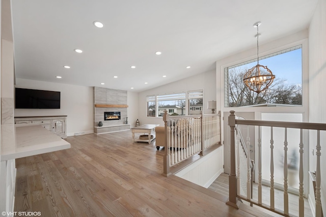 316 Nellie Ct, Glenview, IL 60025 - living area with a chandelier, a large fireplace, wood finished floors, and recessed lighting