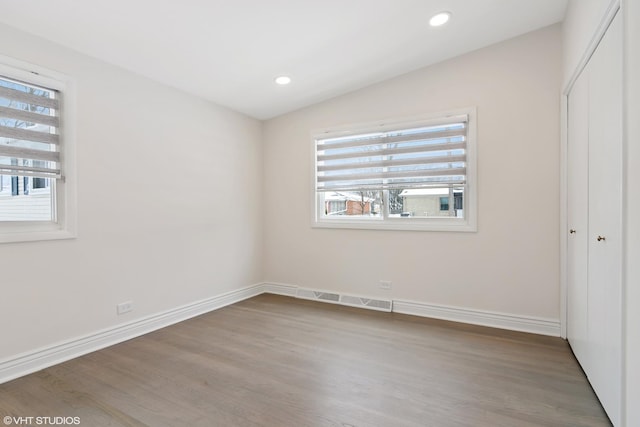 316 Nellie Ct, Glenview, IL 60025 - unfurnished bedroom with wood finished floors, a closet, recessed lighting, and vaulted ceiling