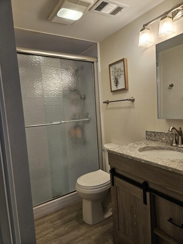 316 Nellie Ct, Glenview, IL 60025 - bathroom featuring wood finished floors, vanity, and a stall shower