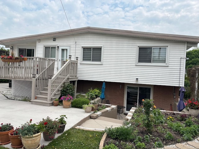 316 Nellie Ct, Glenview, IL 60025 - back of house with a wooden deck, brick siding, and a patio area