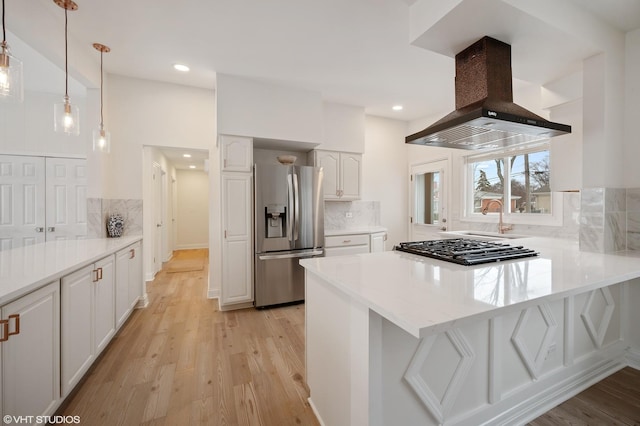 316 Nellie Ct, Glenview, IL 60025 - kitchen featuring stainless steel fridge, island exhaust hood, stovetop, a peninsula, and white cabinetry