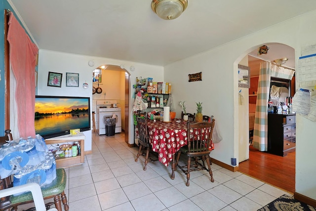 392 Plum Ct, Elgin, IL 60120 - dining area with arched walkways and light tile patterned floors